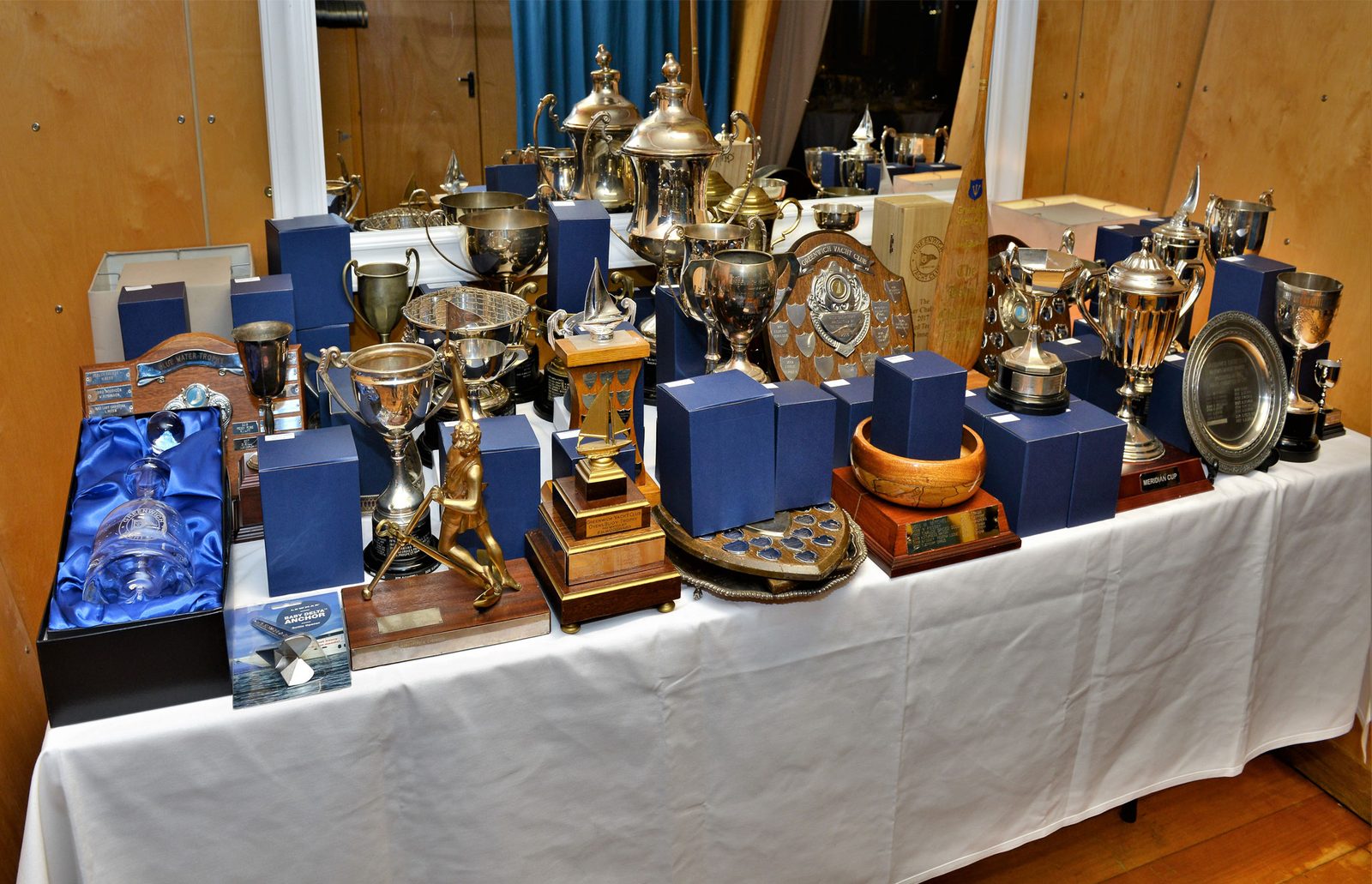 The club trophies laid out on a white cloth for the annual prizegiving
