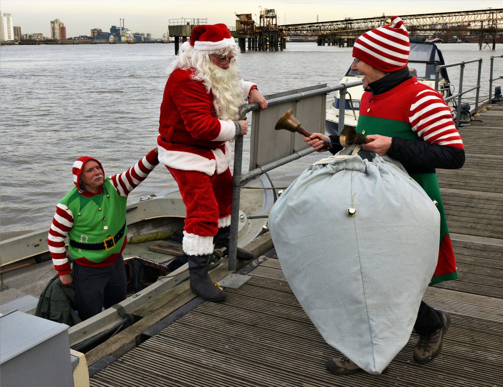 Santa and an elf on the pontoon at the club Christmas party